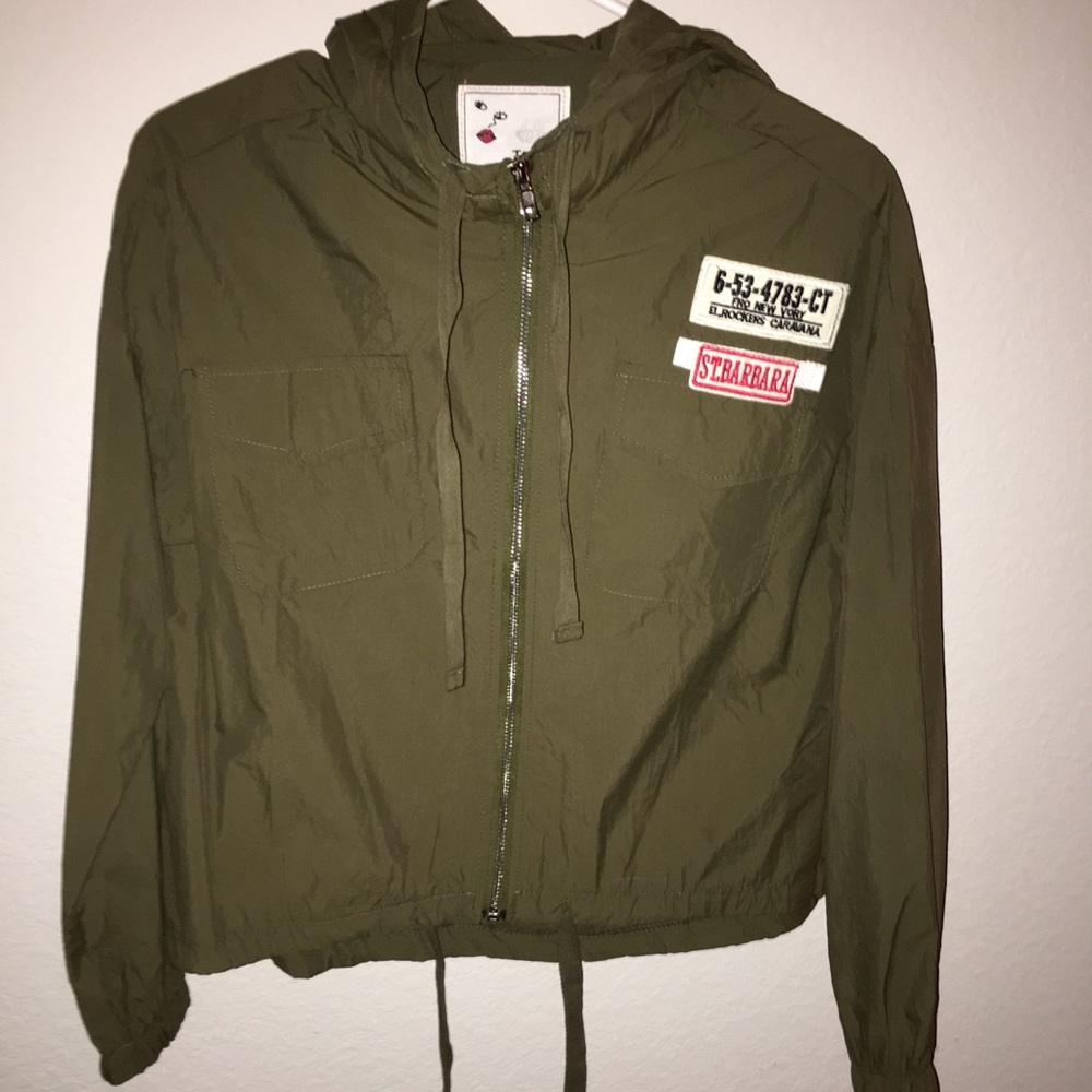 A dark green zip up jacket